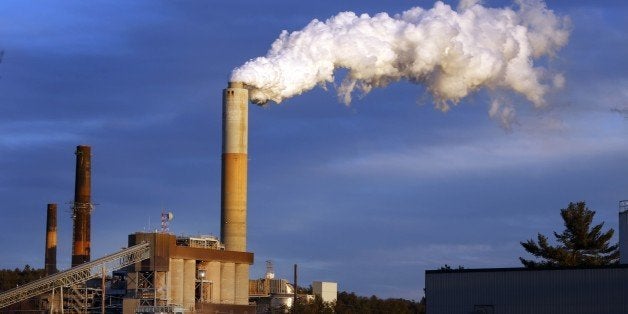 FILE - In this Tuesday Jan. 20, 2015 file photo, a plume of steam billows from the coal-fired Merrimack Station in Bow, N.H. Colorado Gov. John Hickenlooper, whose state relies heavily on coal for energy, is openly rejecting Senate Majority Leader Mitch McConnell's call for states to defy new federal pollution controls on coal-burning power plants. (AP Photo/Jim Cole, File)