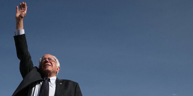 BURLINGTON, VT - MAY 26: U.S. Sen. Bernie Sanders (I-VT) waves to supporters before officially announcing his candidacy for the U.S. presidency during an event at Waterfront Park May 26, 2015 in Burlington, Vermont. Sanders will run as a Democrat in the presidential election and is former Secretary of State Hillary ClintonÃs first challenger for the Democratic nomination. (Photo by Win McNamee/Getty Images)