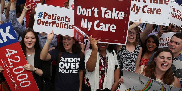 WASHINGTON, DC - JUNE 25: People celebrate in front of the US Supreme Court after ruling was announced on the Affordable Care Act. June 25, 2015 in Washington, DC. The high court ruled that the Affordabvle Care Act may provide nationwide tax subsidies to help poor and middle-class people buy health insurance. (Photo by Mark Wilson/Getty Images)