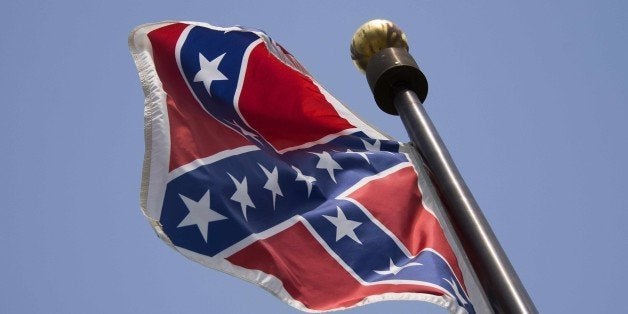 The Confederate Flag flies on the South Carolina State House grounds in Columbia, South Carolina, June 24, 2015. The Confederate battle flag was taken down Wednesday outside Alabama's state legislature as Americans increasingly shun the Civil War era saltire after the Charleston church massacre. AFP PHOTO/JIM WATSON (Photo credit should read JIM WATSON/AFP/Getty Images)