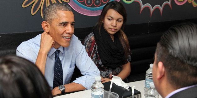 WASHINGTON, DC - NOVEMBER 20: U.S. President Barack Obama has lunch with Standing Rock Sioux Tribal Youth at We, The Pizza/Good Stuff Eatery following an Oval Office greeting on November 20, 2014 in Washington, DC. President Obama invited the youth group to visit the White House during a trip to the Standing Rock Sioux Reservation in Cannonball, North Dakota in June. (Photo by Martin H. Simon-Pool/Getty Images)