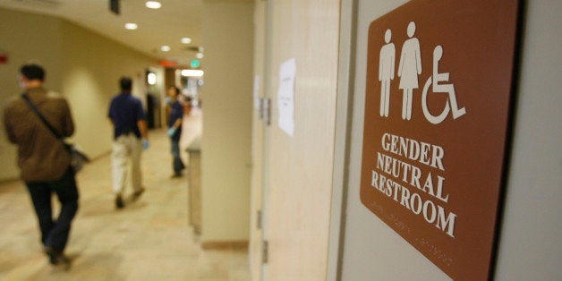 FILE- In this Aug. 23, 2007 file photo, a sign marks the entrance to a gender neutral restroom at the University of Vermont