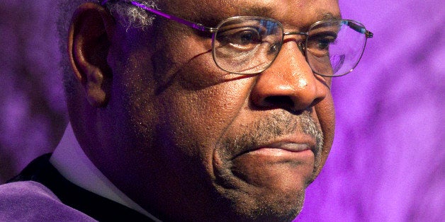 Supreme Court Justice Clarence Thomas pauses while speaking about his time as a student at College of the Holy Cross after receiving an honorary degree from the college, Thursday, Jan. 26, 2012, in Worcester, Mass. (AP Photo/Michael Dwyer)