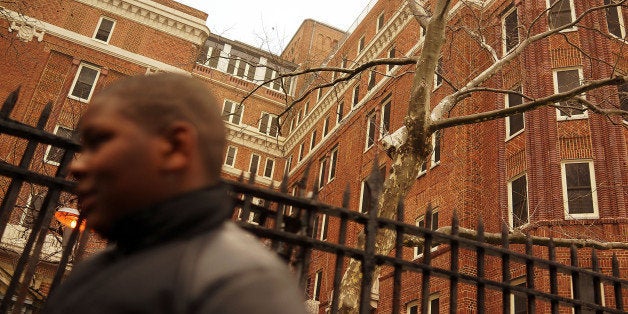 NEW YORK, NY - FEBRUARY 21: Elijah Salters stands in front of The Auburn Family Residence, a shelter for homeless families and individuals on February 21, 2014 in the Fort Greene neighborhood of the Brooklyn borough of New York City. New York Mayor Bill de Blasio announced on Friday that the city is removing hundreds of children from two city-owned homeless shelters after numerous reports of poor living conditions over the last decade. Rampant violence, cockroaches, insufficient heat and spoiled food were just some of the conditions that state and city inspectors have cited. According to a recent study by the United States Department of Housing and Urban Development, New York City's homeless population increased by 13 percent at the beginning of 2013. (Photo by Spencer Platt/Getty Images)