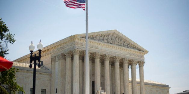 The Supreme Court building in Washington, Monday, June 30, 2014, following various court decisions. The court ruled on birth control, union fees and other cases. (AP Photo/Pablo Martinez Monsivais)