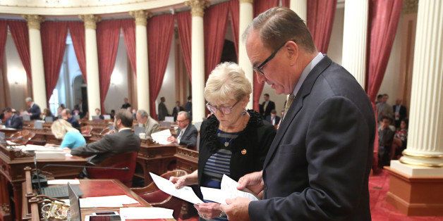 Sen. Sharon Runner, R-Lancaster, and Senate Minority Leader Bob Huff, R-Diamond Bar, review some papers before the Senate takes up the state budget at the Capitol in Sacramento, Calif., Monday, June 15, 2015. California lawmakers approved a new $117.5 billion budget plan. (AP Photo/Rich Pedroncelli)