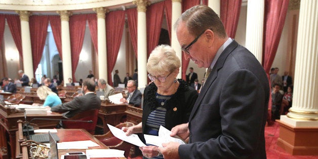 Sen. Sharon Runner, R-Lancaster, and Senate Minority Leader Bob Huff, R-Diamond Bar, review some papers before the Senate tak