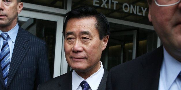 SAN FRANCISCO, CA - MARCH 31: California State Sen. Leland Yee (C) leaves the Phillip Burton Federal Building after a court appearance on March 31, 2014 in San Francisco, California. Yee appeared in federal court today for a second time after being arrested along with 25 others by F.B.I. agents last week on political corruption and firearms trafficking charges. Yee is free on a $500,000 unsecured bond. (Photo by Justin Sullivan/Getty Images)