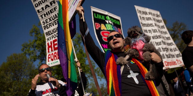 WASHINGTON, DC - APRIL 28: Supporters and opponents of same-sex marriage demonstrate near the Supreme Court, April 28, 2015 in Washington, DC. On Tuesday the Supreme Court heard arguments concerning whether same-sex marriage is a constitutional right, with decisions expected in June. (Photo by Drew Angerer/Getty Images)