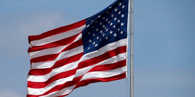 An American flag flies in center field of PNC Park during a baseball game between the Pittsburgh Pirates and the Philadelphia