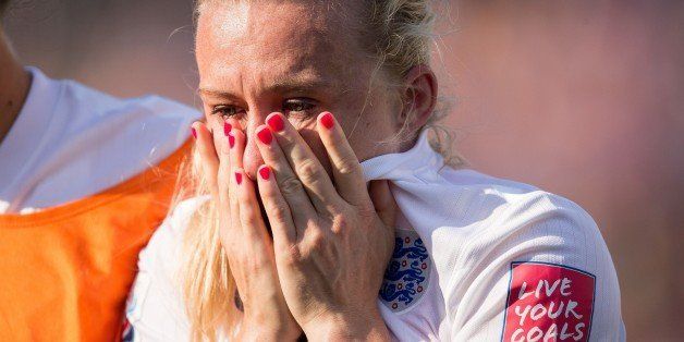 England's Laura Bassett weeps after she scored an own-goal in the last minutes of the game giving Japan the win in their semifinal match at the FIFA Women's World Cup at Commonwealth Stadium in Edmonton, Canada on July 1, 2015. AFP PHOTO/GEOFF ROBINS (Photo credit should read GEOFF ROBINS/AFP/Getty Images)