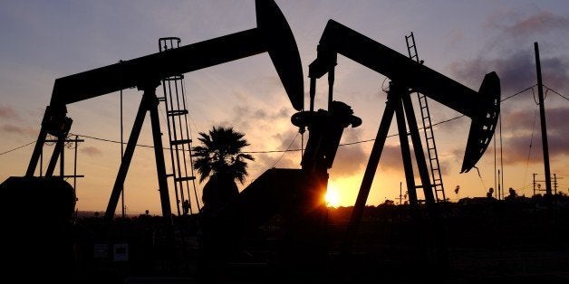 This Thursday March 6, 2014 photo shows the setting sun behind pumpjacks operating at the Inglewood oil fields in the Baldwin Hills area of Los Angeles. The Los Angeles City Council has taken steps to prohibit hydraulic fracturing, or fracking. (AP Photo/Richard Vogel)