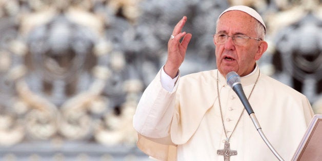 Pope Francis delivers his blessing at the end of his weekly general audience, in St. Peter's Square, at the Vatican, Wednesday, June 24, 2015. (AP Photo/Riccardo De Luca)