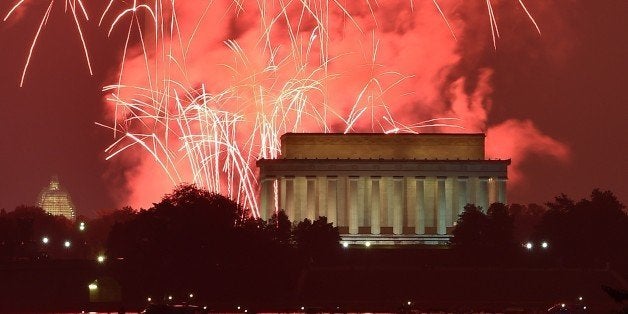 Fireworks explode over the Lincoln Memorial, the Washington Monument and the US Capitol in celebration of Independence Day in
