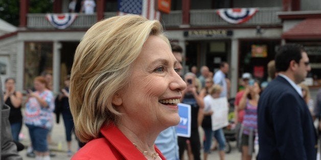 GORHAM, NH - JULY 4: Democratic presidental candidate Hillary Clinton marches in the Gorham fourth of July parade July 4, 2015 in Gorham, New Hampshire. Clinton is on a two day swing through the first in the nation primary state over the fourth of July holiday.(Photo by Darren McCollester/Getty Images)