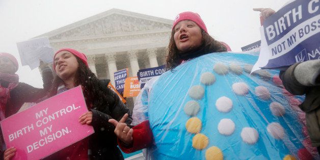 Margot Riphagen of New Orleans, La., wears a birth control pills costume as she protests in front of the Supreme Court in Washington, Tuesday, March 25, 2014, as the court heard oral arguments in the challenges of President Barack Obama's health care law requirement that businesses provide their female employees with health insurance that includes access to contraceptives. Supreme Court justices are weighing whether corporations have religious rights that exempt them from part of the new health care law that requires coverage of birth control for employees at no extra charge. (AP Photo/Charles Dharapak)
