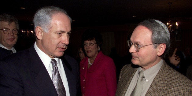 Former prime minister of Israel, Benjamin Netanyahu, left, speaks with National President of Zionist Organization of America, Morton Klein, right, during a dinner honoring Rechavam Zeevi, in New York's Roosevelt Hotel, Sunday, Jan. 6, 2001. Zeevi who was Israel's minister of tourism and also a retired army general was assassinated last year. (AP Photo/Robert Mecea)