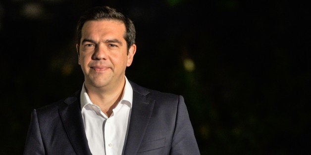 Greek Prime Minister Alexis Tsipras leaves his office before his meeting with the Greek President in Athens on July 5, 2015.