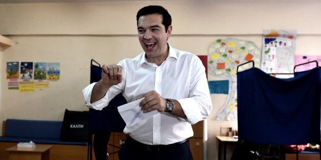 Greek Prime Minister Alexis Tsipras prepares to vote during the Greek referendum in Athens on July 5, 2015. Greek voters head