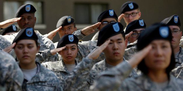 Soldiers from the U.S. Army's 2nd Infantry Division salute during the Combined Division activation ceremony at Camp Red Cloud in Uijeongbu, South Korea, Wednesday, June 3, 2015. This combined division will consist of the U.S. Army's 2nd Infantry Division and a brigade of the South Korea Army. (AP Photo/Lee Jin-man)