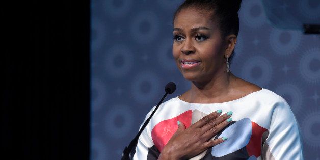 First lady Michelle Obama speaks at the MORE Magazine's first-ever MORE Impact Awards Luncheon at the Newseum in Washington, Monday, June 29, 2015. Mrs. Obama spoke about the importance of expanding access to education for adolescent girls around the world. (AP Photo/Susan Walsh)