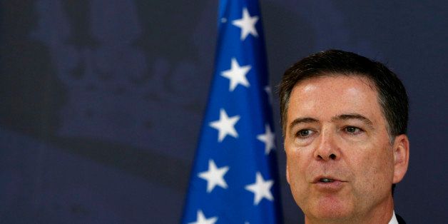FBI Direcotr James Comey speaks during a news conference after talks with Serbian Interior Minister Nebojsa Stefanovic in Belgrade, Serbia, Tuesday, June 23, 2015. Comey arrived on a one-day visit to Belgrade where he is to hold several meetings with Serbia officials. (AP Photo/Darko Vojinovic)