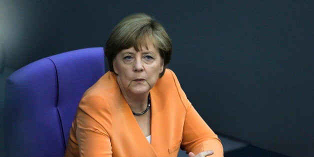 German Chancellor Angela Merkel attends a debate on the Greek financial crisis, at the German parliament , the Bundestag , in Berlin, Wednesday, July 1, 2015. (AP Photo/Markus Schreiber)