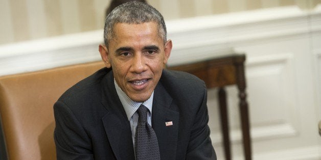 US President Barack Obama speaks about immigration reform during a meeting with young immigrants, known as DREAMers, in the Oval Office of the White House in Washington, DC, February 4, 2015. The group has received Deferred Action for Childhood Arrivals (DACA), which provides relief from deportation for immigrants who arrived in the US illegally before they were 16 years old. AFP PHOTO / SAUL LOEB (Photo credit should read SAUL LOEB/AFP/Getty Images)