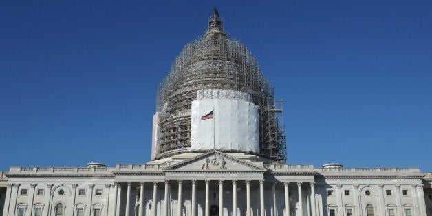 A February 11, 2015 photo shows the US Capitol with its dome encased in scaffolding as it undergoes renovation in Washington, DC. The White House revealed to lawmakers on Tuesday details of its request to Congress for a three-year war authority to battle Islamic extremists that would prohibit 'enduring' offensive combat operations. AFP PHOTO/MANDEL NGAN (Photo credit should read MANDEL NGAN/AFP/Getty Images)