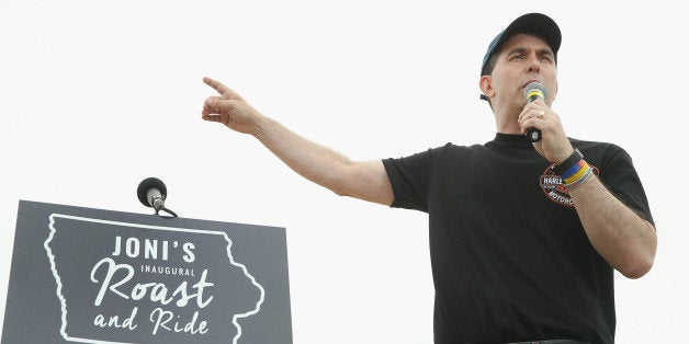 BOONE, IA - JUNE 06: Republican presidential hopeful Wisconsin Governor Scott Walker speaks at a Roast and Ride event hosted by freshman Senator Joni Ernst (R-IA) on June 6, 2015 in Boone, Iowa. Ernst is hoping the event, which featured a motorcycle tour, a pig roast, and speeches from several 2016 presidential hopefuls, becomes an Iowa Republican tradition. (Photo by Scott Olson/Getty Images)