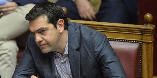 Greek Prime Minister Alexis Tsipras listens during a parliamentary session at the Greek Parliament in Athens on July 10, 2015. Lawmakers in Greece are to vote whether to back a last-ditch reform plan the government submitted to creditors overnight in a bid to stave off financial collapse and exit from the Eurozone. Greece's international creditors believe its latest debt proposals are positive enough to be the basis for a new bailout worth 74 billion euros, an EU source said June 10. AFP PHOTO / ANDREAS SOLARO (Photo credit should read ANDREAS SOLARO/AFP/Getty Images)