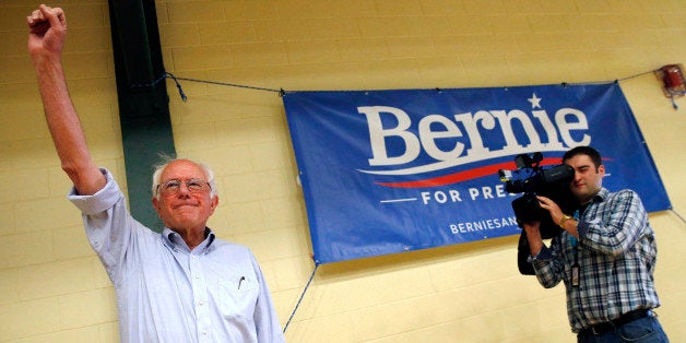 Democratic presidential candidate Sen. Bernie Sanders, I-Vt., waves to the crowd before speaking during a town hall meeting at Nashua Community College in Nashua, N.H., Saturday, June 27, 2015. (AP Photo/Michael Dwyer)