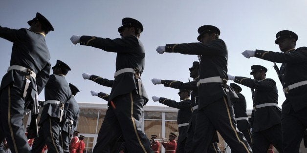 Bahraini Honor Guard parade as they prepare for the opening of the Bahrain International Airshow 2014, in Sakhir, south of the capital Manama, on January 16, 2014. AFP PHOTO/MOHAMMED AL-SHAIKH (Photo credit should read MOHAMMED AL-SHAIKH/AFP/Getty Images)