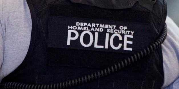 Department of Homeland Security Police officers stand guard inside the terminal at Hartsfield-Jackson airport at the entrance