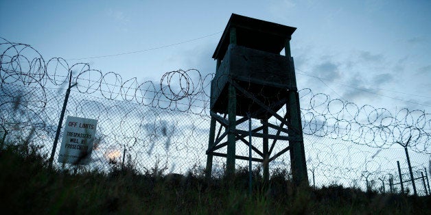 In this photo reviewed by the U.S. military, dawn arrives at the now abandoned Camp X-Ray, which was used as the first detent