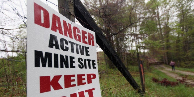 MONTGOMERY CREEK, KY - APRIL 18: A sign warns of surface coal mining operations in the Appalachian Mountains on April 18, 2012 in Montgomery Creek, Kentucky. Some types of surface mining on mountains are known as 'mountaintop removal mining' which has destroyed 500 mountain peaks and at least 1,200 miles of streams while leading to increased flooding. The Appalachians are some of the oldest mountains on Earth. (Photo by Mario Tama/Getty Images)