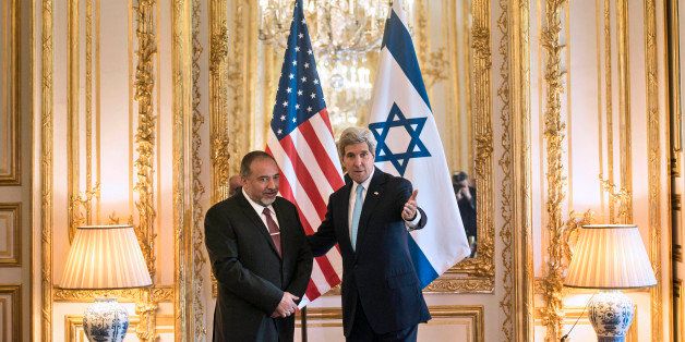 US Secretary of State John Kerry, right, and Israeli Foreign Minister Avigdor Lieberman pose for a photograph before a meeting at the US Chief of Mission Residence in Paris, France, Thursday, June 26, 2014. US Secretary of State John Kerry arrived in Paris on June 26, 2014 after stops in Baghdad, Arbil and Brussels to brief his Saudi, French and Israeli counterparts on his talks in Iraq and discuss the bloody three-year war in Syria. (AP Photo/Brendan Smialowski, pool)