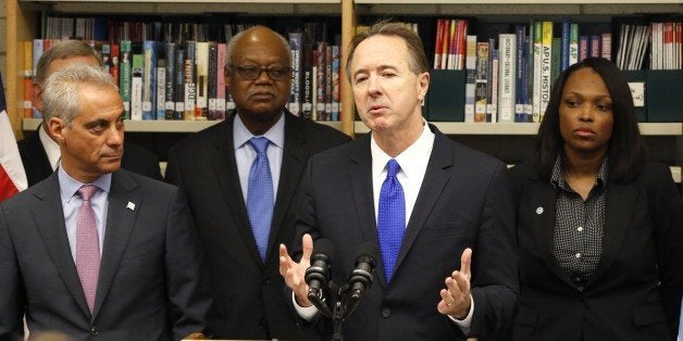 Forrest Claypool, second from right, and new CEO of Chicago Public Schools, addresses reporters after Mayor Rahm Emanuel, lef