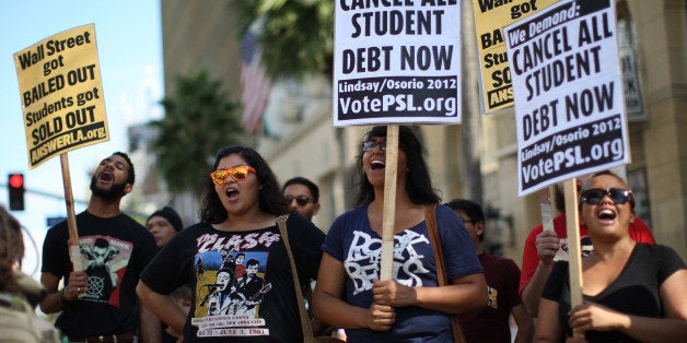 LOS ANGELES, CA - SEPTEMBER 22: Students protest the rising costs of student loans for higher education on Hollywood Boulevard on September 22, 2012 in the Hollywood section of Los Angeles, California. Citing bank bailouts, the protesters called for student debt cancelations. (Photo by David McNew/Getty Images)