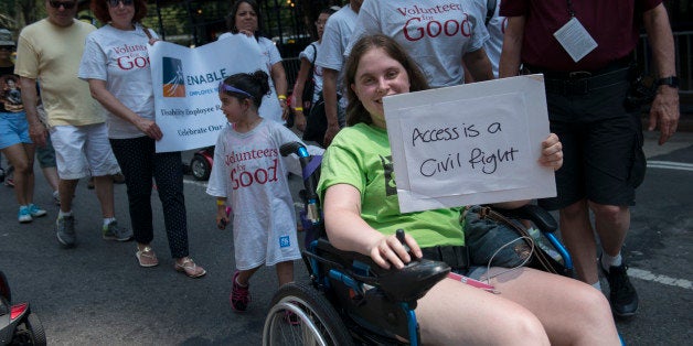 NEW YORK, NY - JULY 12: People participate in the first annual Disability Pride Parade on July 12, 2015 in New York City. The parade calls attention to the rights of people with disabilities and coincides with the 25th anniversary of the Americans with Disabilities Act. (Photo by Stephanie Keith/Getty Images)