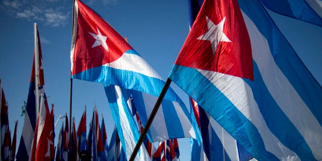 Students march carrying Cuban flags during a march against terrorism in Havana, Cuba, Tuesday, Sept. 30, 2014. Youths marched