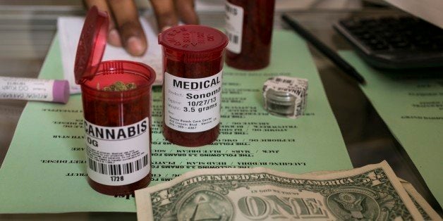 In this photo taken Tuesday, May 14, 2013, Medical marijuana prescriptions vials are filled at the Venice Beach Care Center medical marijuana dispensary in Venice, Calif. Los Angeles politicians have tried and failed for so long to regulate medical marijuana that it was only a matter of time before voters got a chance to control shops that have proliferated. Complicating matters, there are three measures on Tuesday's ballot that would allow sick people to get the drug, but either limit the number of shops, raise taxes or do both. (AP Photo/Damian Dovarganes)