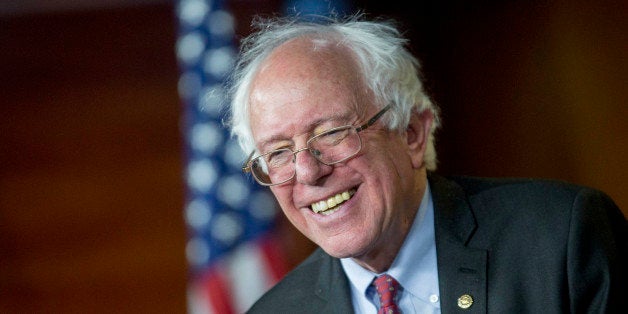 Senator Bernie Sanders, an Independent from Vermont, smiles while responding to a question during a news conference on Capitol Hill in Washington, D.C., U.S., on Wednesday, April 29, 2015. Sanders is preparing to enter the race for the Democratic presidential nomination on April 30, according to a person familiar with Sanders' plans. Photographer: Andrew Harrer/Bloomberg via Getty Images 