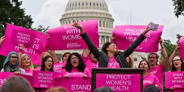 Cheered on by Carol McDonald from Planned Parenthood Federation of America, women rally on Capitol Hill in Washington, Thursd