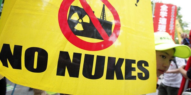 HIROSHIMA, JAPAN - AUGUST 06: People take part in an anti-nuclear power protest on the 66th anniversary of the Hiroshima ato