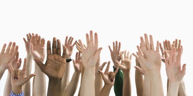 A large group of raised hands