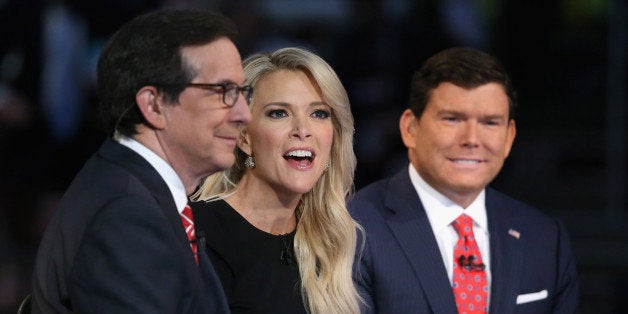 CLEVELAND, OH - AUGUST 06: FOX News anchors (L-R) Chris Wallace, Megyn Kelly and Bret Baier moderate the first prime-time Republican presidential debate hosted at the Quicken Loans Arena August 6, 2015 in Cleveland, Ohio. The top-ten GOP candidates were selected to participate in the debate based on their rank in an average of the five most recent national political polls. (Photo by Chip Somodevilla/Getty Images)