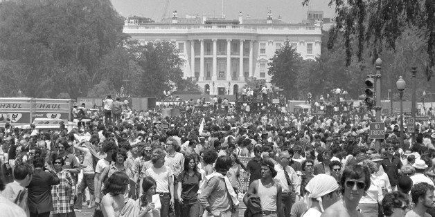 Antiwar demonstrators raise thier hands toward the White House as they protest the Vietnam war in Washington D.C., on May 9, 1970. (AP Photo)