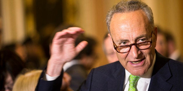 FILE - In this May 5, 2015, file photo, Sen. Charles Schumer, D-N.Y., speaks to reporters on Capitol Hill in Washington. Schumer wants airlines to scrap a proposal to reduce the allowed size of carry-on luggage. He planned a news conference Sunday, June 14, 2015, to warn travelers that a 20 percent reduction would force them to pay more for check-in fees or spend money on new luggage. (AP Photo/Brett Carlsen, File)