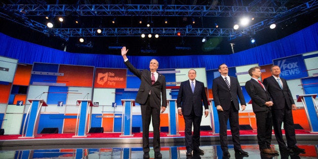 Republican presidential candidates from left, former Florida Gov. Jeb Bush, former Arkansas Gov. Mike Huckabee, Sen. Ted Cruz
